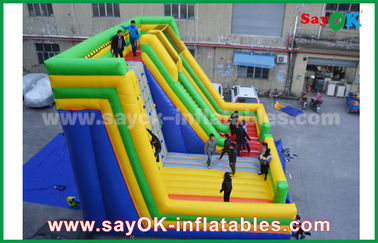 Deslizador inflables comerciales 9.5 * 7.5 * 6.5m colorido deslizador inflables de salpicador con pared de escalada para parque de diversiones