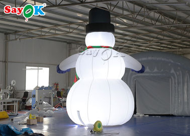 Las decoraciones inflables del día de fiesta del paño de Oxfor que llevan el sombrero negro y las manoplas explotan el muñeco de nieve de la Navidad