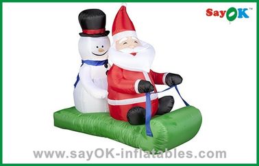 La Navidad Papá Noel o decoraciones inflables del día de fiesta del muñeco de nieve con el trineo